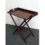 19th century butler's table - A mahogany tray with two cut handles and X framed stand, height