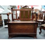 Arts and Crafts monk's bench - An oak open arm gate back bench with compartments under seat,