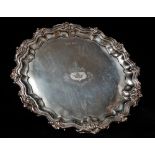 A silver salver with engraved armorial to centre with motto 'Quid Verum Atque Decens Curo Et