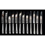 A set of twelve silver handled table knives, Sheffield 1987, maker's mark for Yates Brothers,