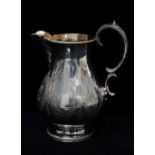 A silver Masonic footed jug with double veloupe handle, inscribed 'Presented by the members of St