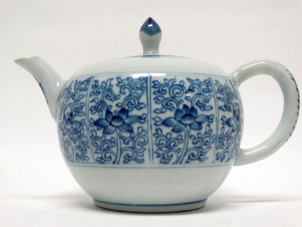 Circa 1900 Chinese lidded teapot - A blue and white peony and scroll decorated teapot, height 11.5. - Image 2 of 4