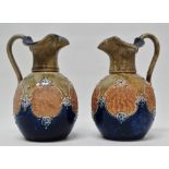 Royal Doulton England - A pair of glazed and bas relief decorated jugs, marked 8294 and maker's mark