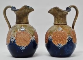 Royal Doulton England - A pair of glazed and bas relief decorated jugs, marked 8294 and maker's mark