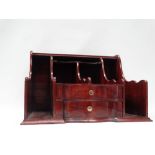 An 18th century style hardwood postage desk stand with shelves and two serpentine shape drawers,