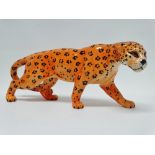 Beswick - A leopard, height 12cm, length 30cm.