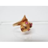 High carat gold and ruby ring - A high carat gold ring in the form of a stylised fish set five