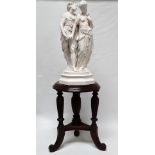 Bouret spelter - A painted spelter figure group of two lovers on an octagonal socle, standing on a