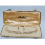 Pearl two piece suite - A Ciro of Bond St, London & New York two strand pearl choker with 9ct gold