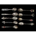 A collection of silver teaspoons, .800 and .925, many with guilloche enamel terminals, weight 79g.