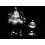 A silver tea caddy of inverted baluster melon shape, with hinged lid and standing on four lion's paw