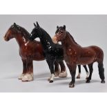 Beswick - Three equine figures, a shire, 'CH. Black Magic' and another 'Exmoor', largest height 21.