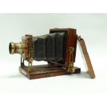 A quarter-plate Lancaster's Special Instantograph brass-bound mahogany tailboard camera with
