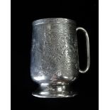 A silver footed christening mug, bright cut and foliate decoration, Birmingham 1890, maker's mark