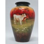 Soleilian - A hand painted vase with two calves in a landscape, indistinct raised mark to base,