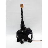 Ebony table lamp - A carved elephant with square pagoda style top section with shaft, height 40cm,
