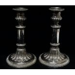 A pair of filled silver candlesticks, monogram to shaft, Sheffield 1819, maker's mark for John &