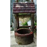 A reconstituted stone 'Wishing Well', height 103cm, well diameter 53cm.