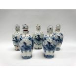 Dutch Delft - A set of five Erven Lucas Bols stoppered loop handled bottle jugs, height 21.7cm.