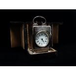 A silver cased miniature clock with a French movement, Birmingham 1914, maker's mark for Henry