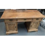 Victorian pine pedestal desk - A desk comprising of three drawers to the top, two cupboards to