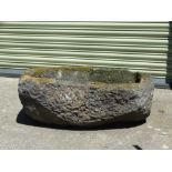 A large reconstituted stone garden trough, height 36cm, 87 x 57cm.