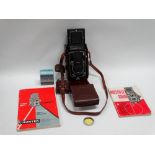 A Rolleiflex twin lens reflex camera No. 1725293 with Tessar 75mm f 3.5 lens in Synchro-Compur
