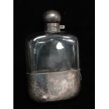 A silver plated hip flask with monogram and retailer's mark for Drew & Sons, Piccadilly Circus,