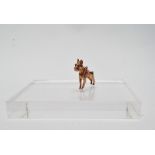 A gold boxer dog pendant/charm - A .375 cast figure of an adult boxer dog standing, with red stone