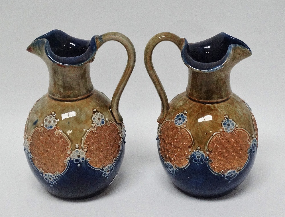 Royal Doulton England - A pair of glazed and bas relief decorated jugs, marked 8294 and maker's mark - Image 4 of 4