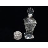 A cut glass perfume bottle of square tapering form with silver collar, London 1920, maker's mark for