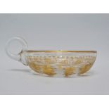 St. Louis - A gilt and clear glass wine taster/tastevin with loop handle, diameter 10.5cm.