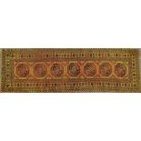 A copper wash Afghan hand knotted wool runner, 290 x 92.5cm.