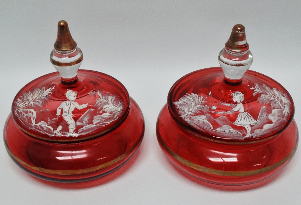 19th century Mary Gregory - A pair of cranberry glass gilt lined decoration lidded dressing table