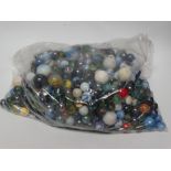 Marbles - A large quantity of 19th century and later, mostly glass marbles, ceramic, steel marbles