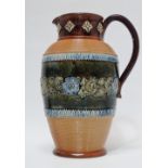 Doulton Lambeth England - A tall handled jug with bas relief, 8852 and stamped maker's mark 'ha'