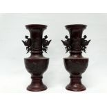 Chinese bronze vases - A pair of patinated bronze vases, circa 1900, with twin handles modelled as