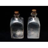 18th/19th century travelling decanters - A pair of handmade squared, clear glass decanters and