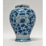 Delft - A blue and white inverted baluster vase decorated with peonies and petals, height 15cm.
