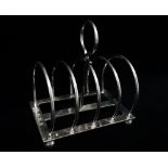 A Victorian silver four sectional toast rack, Edinburgh 1899, maker's mark for Hamilton & Inches,