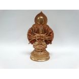 A gilt bronze Indo-Chinese votive sculpture of Ardhanarishvara in lotus position and on stepped