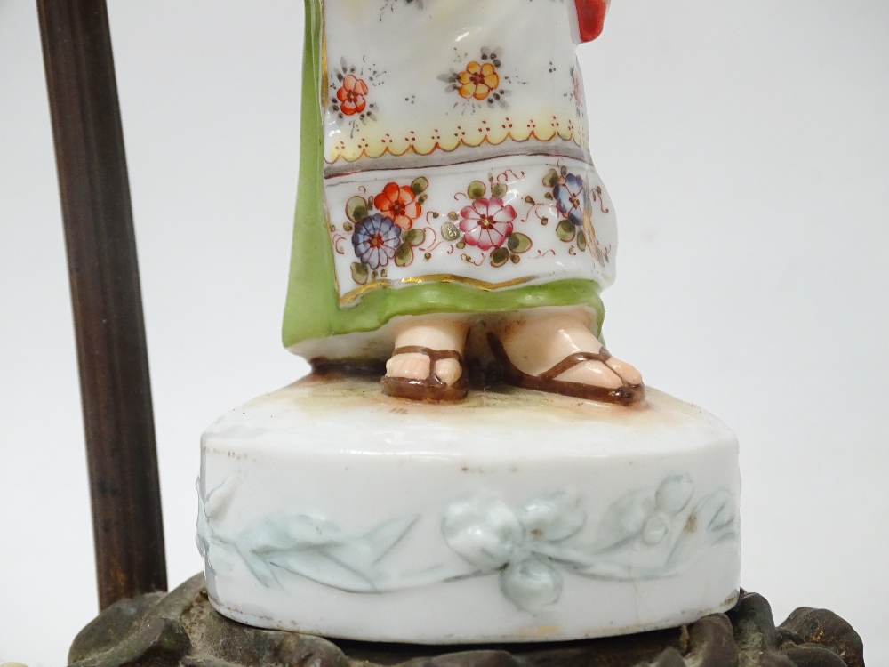 1920s Table Lamp - A Rococo gilt brass based electric lamp with a hand painted western woman dressed - Image 3 of 5