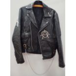 Vintage Fashion - A black leather jacket embellished with studs, chains, safety pins and Sex Pistols
