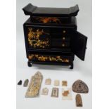 Thailand and Vietnam - A black lacquered table cabinet with gilt painted decoration, comprising of