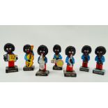 The Robertson Golly Sextet - A collection of seven hand painted pottery figures of musicians,