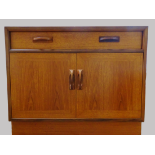 G-Plan Red - A teak cabinet with one long drawer over two cupboard doors, height 69cm, width 84cm,