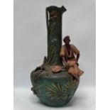 Austrian Ceramics - A polychrome vase and figure of a seated blackamoor with a lute, height 48.5cm.