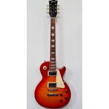 Guitar - A Les Paul? electric guitar, badged Gibson, with solid body and fixed neck, two Humbucker