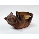 Black Forest Bear - A circa 1900 carved bear with glass eyes modelled holding a brass bowl, height