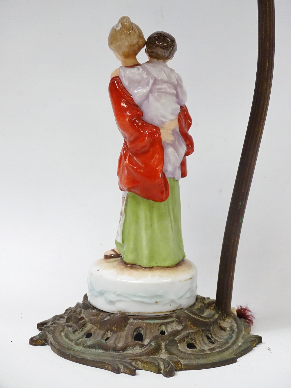 1920s Table Lamp - A Rococo gilt brass based electric lamp with a hand painted western woman dressed - Image 4 of 5